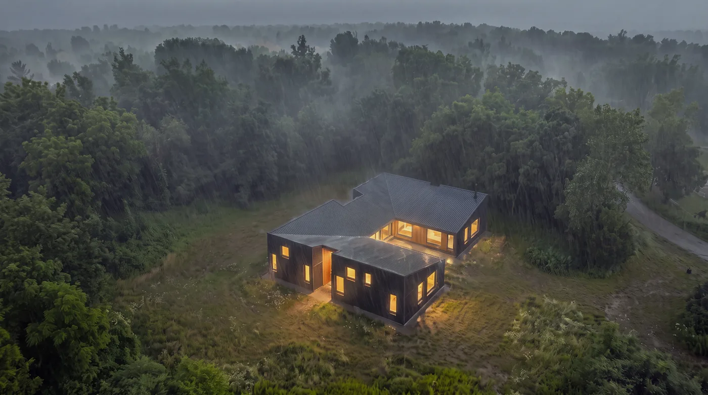Anchor — the house lit and calm inside the storm